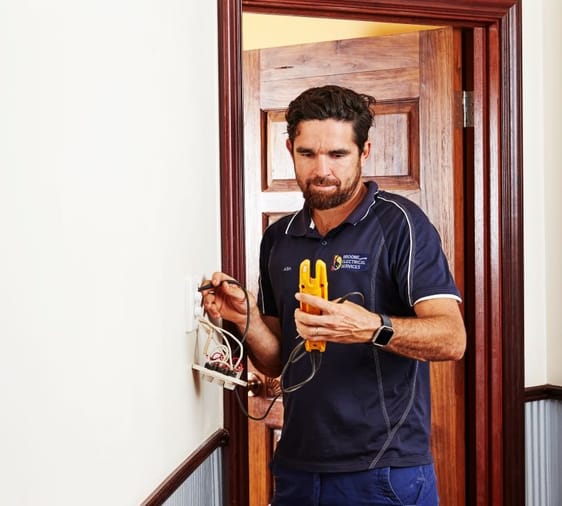 Licensed electrician working on property.